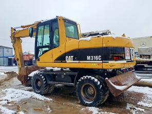 Габаритный колёсный экскаватор б/у CAT 316