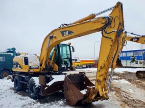 Габаритный колёсный экскаватор б/у CAT 316