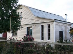 Блочный дом, отделанный сайдингом