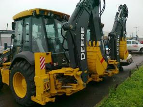 Экскаватор-погрузчик John Deere 325J, 2011 года.