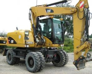 Caterpillar M313D- колесный экскаватор